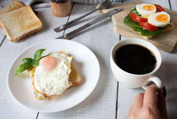 Healthy breakfast with egg, tomatoes and salad. on a wooden table. food