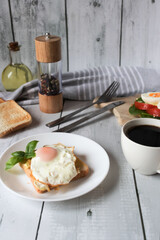 Healthy breakfast with egg, tomatoes and salad. on a wooden table. food