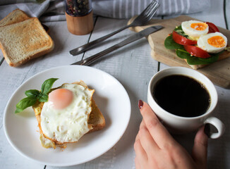 Healthy breakfast with egg, tomatoes and salad. on a wooden table. food