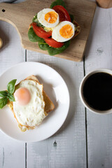 Healthy breakfast with egg, tomatoes and salad. on a wooden table. food