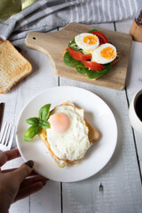 Healthy breakfast with egg, tomatoes and salad. on a wooden table. food