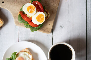 Healthy breakfast with egg, tomatoes and salad. on a wooden table. food