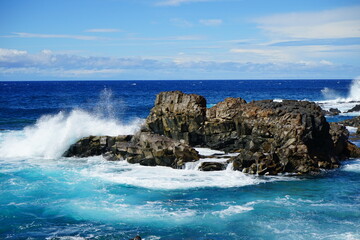 Majestic waves shattering on the rocks