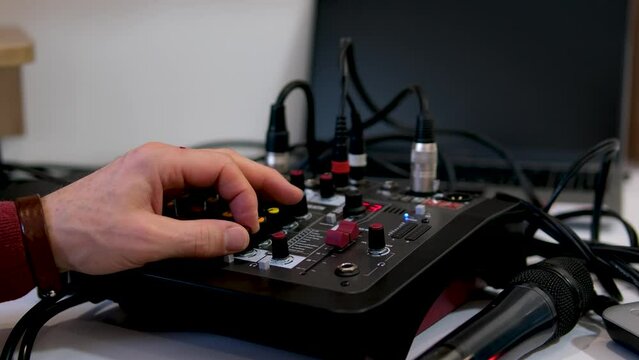 hands DJ sound engineer control the sound. High quality 