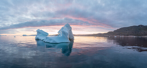 Arctic nature landscape with icebergs in Antarctica with midnight sun sunset sunrise in the...