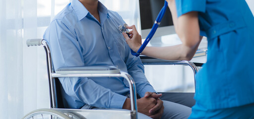 Doctor and patient sitting and talking at medical examination at hospital office, close-up....