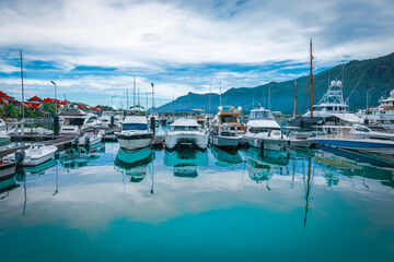 Boats and yachts moored in marina of Eden Island, Mahe Island, Seychelles. - obrazy, fototapety, plakaty