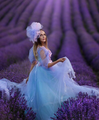 Beautiful provence woman relaxing in lavender field watching on sunset holding basket with lavanda...