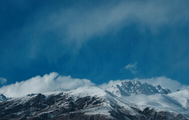 Fototapeta na wymiar Picturesque mountain landscape with snowy peaks