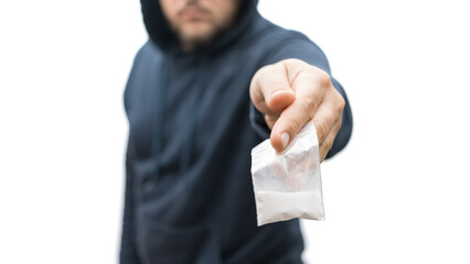 Criminal man in a hood holds transparent plastic bag with white powder hard drugs isolated on white background, drug dealer or gangster sells narcotics - obrazy, fototapety, plakaty