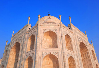 Fototapeta na wymiar Taj Mahal at sunrise is an ivory-white marble mausoleum on the right bank of the river Yamuna in Agra India
