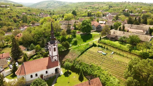 Aerial view of an Ortodox church in the middle of a small village in Serbia