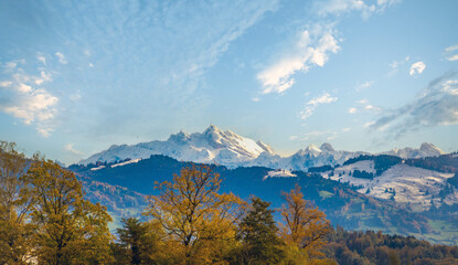 Distant view of the iconic Säntis Peak in the swiss alps from shores of the upper Zurich Lake (Obersee), Rapperswil, St. Gallen, Switzerland