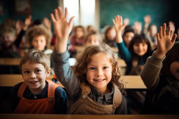 Fototapeta premium Group of school kids raising hands in classroom.