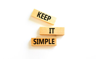 Keep it simple symbol. Concept word Keep it simple on beautiful wooden block. Beautiful white table...