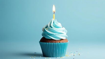 Birthday cupcake with a candle on a light blue background 