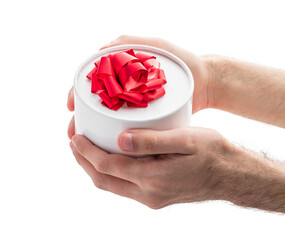 Gift box with red ribbon in a man's hands