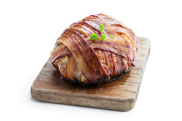 Italian bacon wrapped meatloaf on wooden board isolated on white