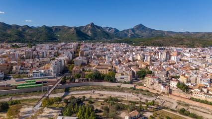 Fototapeta na wymiar Aerial drone photo of the city centre with mountains in the background of Gandia in the Costa Blanca Spain