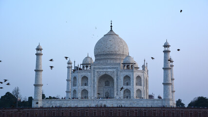 Obraz premium Taj Mahal at sunrise is an ivory-white marble mausoleum on the right bank of the river Yamuna in Agra India