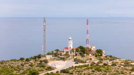 Fototapeta na wymiar Aerial drone photo of the lighthouse at the cliffs of Cap de Sant Antoni in Javea, Spain