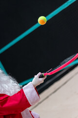 Santa Claus Serving: Christmas Beach Tennis on the Sand Court