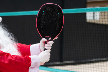 Santa Claus on the Sand Court: Ready for Christmas Beach Tennis - Copy Space