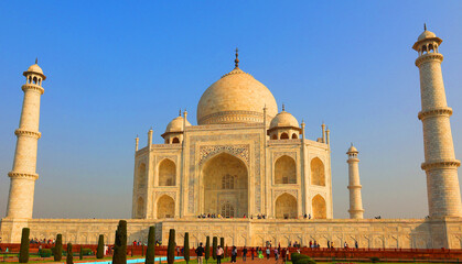 The Taj Mahal at sunrise is an ivory-white marble mausoleum on the right bank of the river Yamuna...