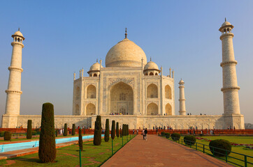 The Taj Mahal at sunrise is an ivory-white marble mausoleum on the right bank of the river Yamuna in Agra 