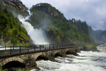 Fototapeta na wymiar Bridge at the twin waterfall Latefossen in the Odda valley, Norway
