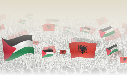 Palestine and Albania flags in a crowd of cheering people.