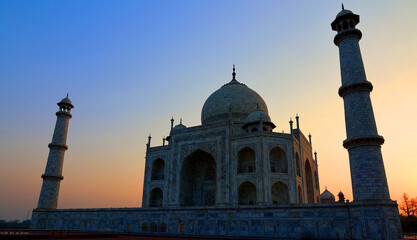 Taj Mahal at sunrise is an ivory-white marble mausoleum on the right bank of the river Yamuna in Agra India