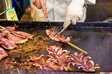 meat on skewers on the grill. Fish is prepared for the barbecue on the grill.
