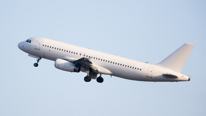 Fototapeta na wymiar Modern passenger airliner on takeoff in the sky