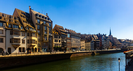 Fototapeta na wymiar Scenic summer cityscape of old town of Strasbourg with half-timbered houses on canals, Alsace, France