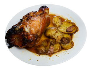 Appetizing pork knuckle baked in oven with boiled potatoes in white plate. Isolated over white background