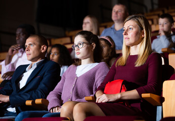 Family viewing of spectacle or concert in the theater auditorium