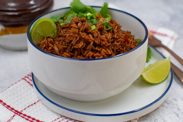 Red ancho rice in white ceramic bowl