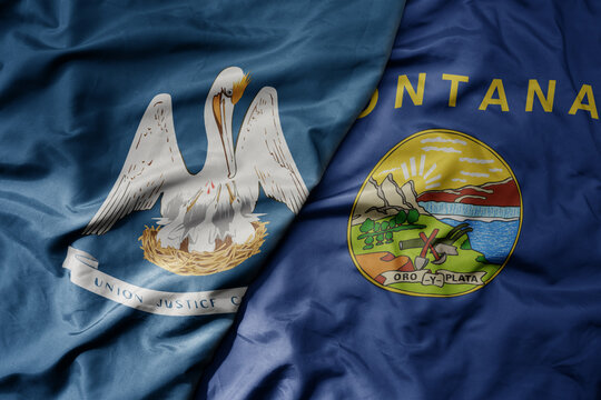 big waving colorful national flag of montana state and flag of louisiana state .