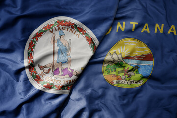 big waving colorful national flag of montana state and flag of virginia state .