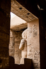 looking through ancient temple hallway in historic Karnak Temple in Luxor Egypt
