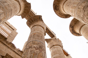 ancient Egyptian hieroglyphs on massive columns of hippostyle hall in karnak temple in luxor, egypt