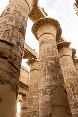 ancient Egyptian hieroglyphs on massive columns of hippostyle hall in karnak temple in luxor, egypt