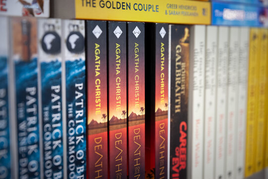 BELGRADE, SERBIA - OCTOBER 23, 2023: Selective blur on the covers of Agatha Christie Crime Novel Death on The Nile on the shelves of a bookstore of Belgrade. Agatha Christie is a british writer.