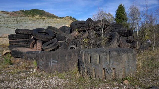 Pile of large worn out tires, waste - (4K)