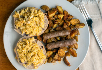 scramble eggs on bagels  served with home fries