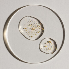 drop of serum with gold on white background, cosmetic textures, skincare product smudge face serum, oil	