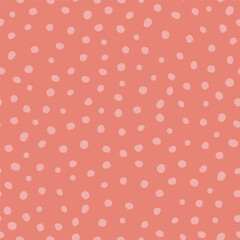 Hand drawn seamless polka dot background. Red spotted textile, fabric design. Cute texture, pastel colors. Backdrop with little circles. Abstract geometric organic shapes.