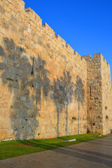 Fototapeta na wymiar Walls of Jerusalem surround the Old City. In 1535 when Jerusalem was part of the Ottoman Empire, Sultan Suleiman I ordered the ruined city walls to be rebuilt in 4 years