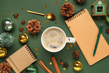 Composition with cup of coffee and Christmas decor on green